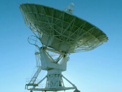 time lapse single VLA (Very Large Array) radio telescope dish moving at sunrise / New Mexico Stock Footage