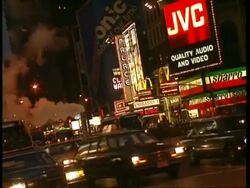 MS traffic driving through city street at night, Neon advertising in background, New York Stock Footage