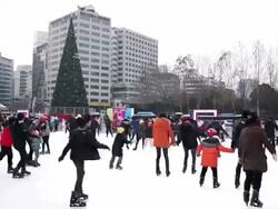 MS T/L People skating at city hall / Seoul, South Korea Stock Footage