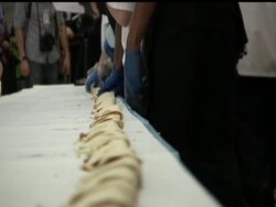 Emory University students hope to build the world's longest line of tacos. Students assembled 200 tortillas, 80 pounds of fish fillets, 45 pounds of cabbage, four gallons of salsa and other ingredients into 121 feet of fish tacos. Instructional Video