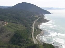 MS AERIAL ZI Car moving on Oregon coast highway / United States Stock Footage