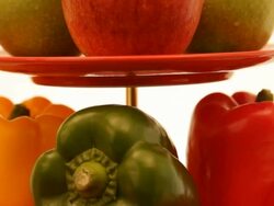 Apples and Capsicums on two tier serving tray Stock Footage