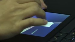 Asus unveils notebook with extra trackpad screen News Clip