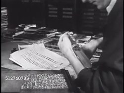 1940: VATICAN CITY: PRESSES: Male compositor arranging printing press typeface, CU Fingers placing letter blocks into tray, typesetting, two male translators working at desk.  The Holy See, Catholic, Christian, Gospel, written word. Instructional Video
