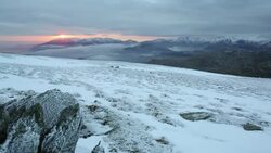 Mist over the Lake District mountains at dusk from the summit of Red Screes, Lake District National Park, Cumbria, UK Stock Footage