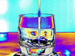 Water being poured into Glass, Colorised View, Slow motion Stock Footage