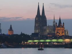 WS T/L VIew of Cologne skyline at dusk (Town Hall, Cathedral, Great St. Martin church, Deutzer Bridge) / Cologne, North Rhine Westphalia, Germany    Stock Footage