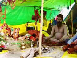MS PAN Shot of Naga Sadhu with pilgrims in tent in Kumbh Mela / Allahabad, Uttar Pradesh, India Stock Footage