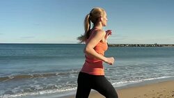 Vital beautiful running along coastline Stock Footage