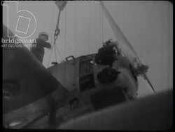 Sailors working in the heat. Cruisers arriving in Djibouti and sailors on leave in the streets. Djibouti, 1945 Stock Footage