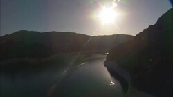 The sun shines above the Colorado River. Stock Footage