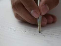 MS Man writing on blackboard and turning back / Singapore Stock Footage