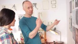 Artist presenting his paintings to a young woman. Stock Footage