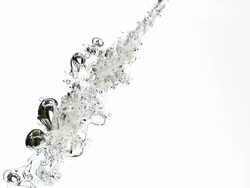 Cooking Oil entering water against white background, Slow motion Stock Footage