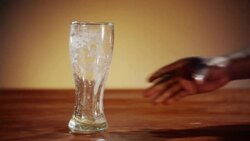 Man putting his empty beer onto the bar counter Stock Footage