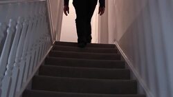 Walking upstairs at night. Stock Footage