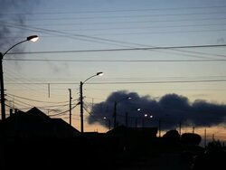 MS Silhouetted rooftops at sunset / Near Porvenir, Chilean Patagonia, Chile Stock Footage