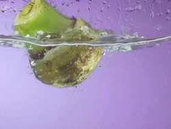 Taro Splashing Into Water (Super Slow Motion) Stock Footage