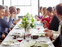 MS group of friends sitting at dinner party in loft eating dinner Stock Footage