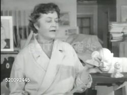 1951: TEACHING HOSPITAL: ART THERAPY: Female Psychiatrist standing in studio talking to doctor students (no SOT). Boat paintings. Doctor students watching. Psychiatrist SOT explaining clay model made by patient, then comparing models made later. Instructional Video