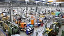 Aerial view of injection molding machines in factory Stock Footage