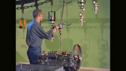 MS PAN Car worker building car parts in car factory / United States Stock Footage
