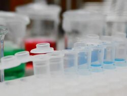 Dropping blue liquid into eppendrof from auto pipette Stock Footage