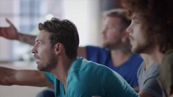 Guys sitting on couch watching tv disappointed Stock Footage