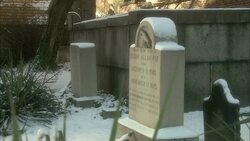Snow dusts the tombstone of Edgar Allan Poe. Stock Footage