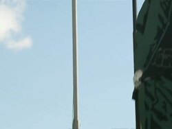 MS TU TD Shot of Man looking at Big Fidel sign town / Cuba Stock Footage