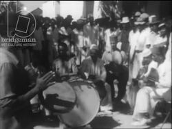 Madagascar c.1958 - A Comorian wedding ceremony with dancing and musicians in Mahajanga Stock Footage