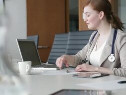 Doctor working in conference room Stock Footage