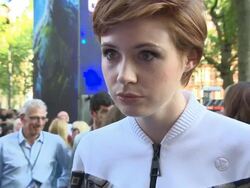 INTERVIEW - Karen Gillan at being at the premiere, being involved in Sci-Fi, what attracted her to the role, the role, her short hair, What she's wearing, her latest projects, working in Hollywood at 'Guardians of the Galaxy' UK Film Premiere Stock Footage
