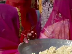 MS Women distributing food during Indian wedding / Rajasthan, India Stock Footage