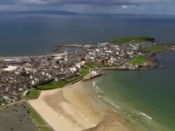 Aerial wide shot pan town of Portrush / County Antrim, Northern Ireland Stock Footage