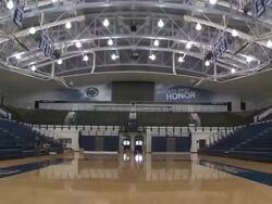 Shot of the interior of the Bryce Jordan Center at Pennsylvania State University.  Shot is from the court and tilts down to the floor Stock Footage