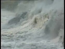 Large dirty wave breaks on base of cliffs, Braer Oil Tanker Spill Shetland islands, UK, 1993. Stock Footage