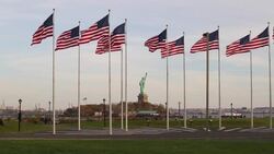 Statue of Liberty and US Flags, New York City, USA Stock Footage