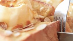 HD: knife cutting bread on dish. Stock Footage