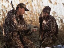 father and son duck hunting Stock Footage