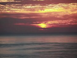 WS View of fiery sunrise sky and ocean / Montezuma, Costa Rica Stock Footage