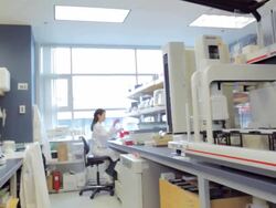 Lab technician working with biomek FX machine for DNA extraction at research center / Vancouver, BC, Canada Stock Footage