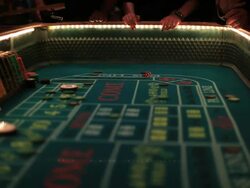 Casino footage, gambling chips and dice on craps table Stock Footage