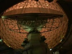 Low Angle static _ A radio telescope rotates on its base / Cambridge, Massachusetts, USA Stock Footage