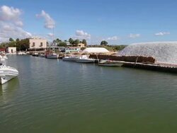 Mozia (Motya), sailnig in the canal to island of Mozia, on the sides there are piles of salt Stock Footage