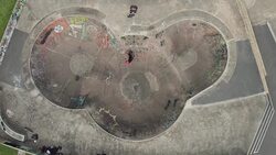 Skateboarder Riding a Bowl at Skatepark Stock Footage