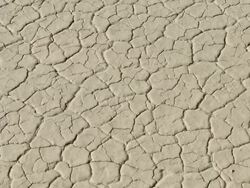 Zoom in to cracked surface of salt pan Stock Footage