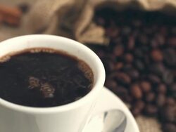 Hot coffee being poured in a cup Stock Footage