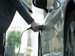 HD: Businessman Unplugging His Car Stock Footage