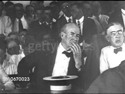 1925: SCOPES MONKEY TRIAL: PAN Interior of packed courtroom, MS Prosecution Lead William Jennings Bryan at table talking w/ unidentified male, MS Assistant Attorney General of Tennessee Ben G. McKenzie standing, gesturing while speaking (No SOT). Instructional Video
